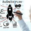 Woman creating a business plan and describing what to do after