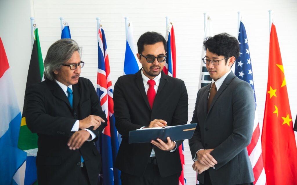 A group of professionals from diverse backgrounds collaborating in a meeting room