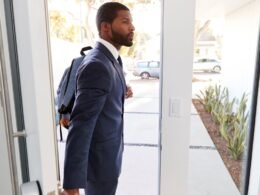 A man with a tech-friendly business backpack