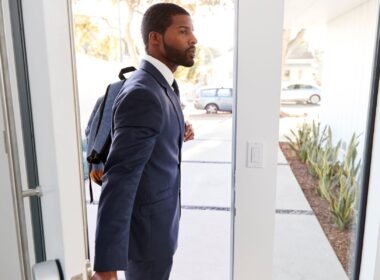 A man with a tech-friendly business backpack