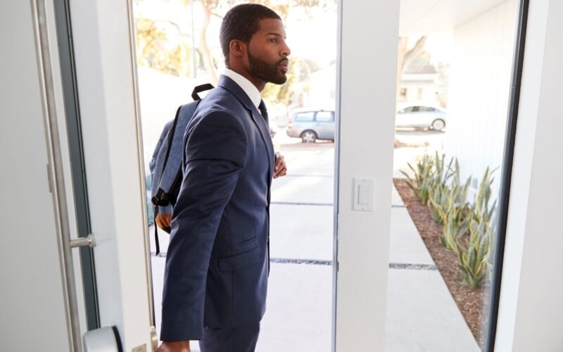 A man with a tech-friendly business backpack