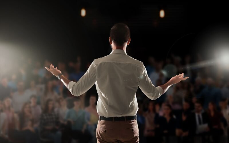 Big room with audience for a man practising his public speaking