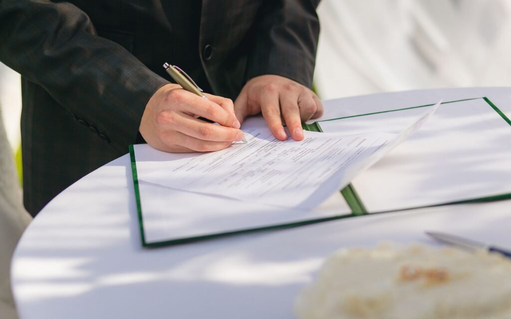 Business license for short-term and long-term rental being filled in with a pen