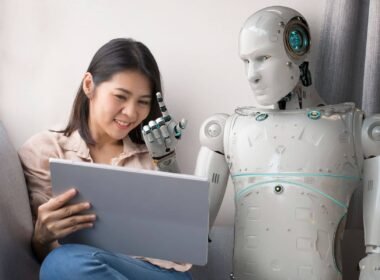 Woman with a laptop and an AI financial advisor robot next to her